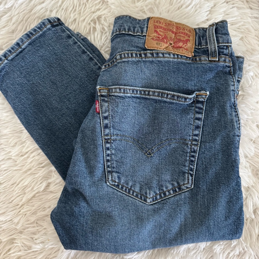 Levi jeans with rips on the knees.